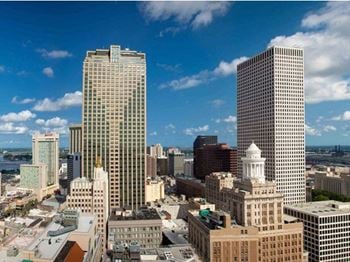 Expansive windows in living rooms and bedrooms overlooking downtown nola